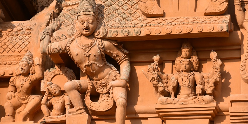 Panchamukha idol of Shiva at Brihadisvara Temple, carved in intricate Chola architecture.