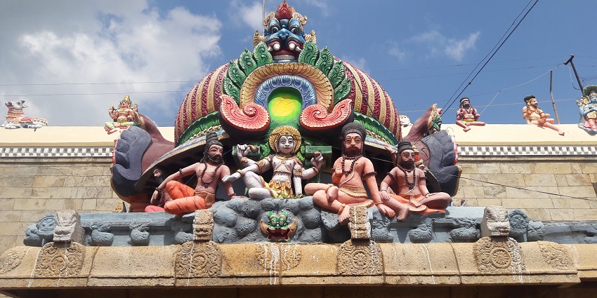Gopuram of Thiruvaiyaru Temple with intricate carvings and colourful statues in Tiruvarur.