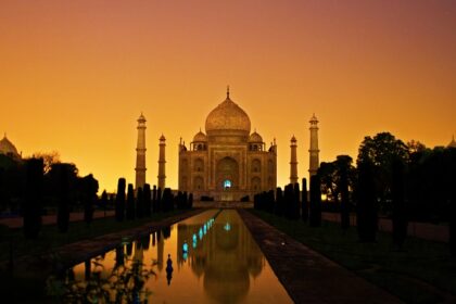 A stunning view of the Taj Mahal, an iconic white marble mausoleum located in Agra.