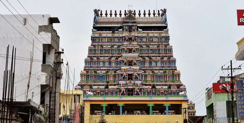 A picture of a decorated temple tower exhibiting a lot of work in a close-up shot.