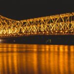 Explore the iconic Howrah Bridge, Howrah showcasing the vibrant things to do in Howrah.