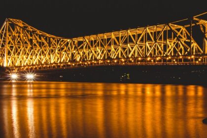 Explore the iconic Howrah Bridge, Howrah showcasing the vibrant things to do in Howrah.