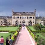 An image of Imamabara in daylight with busy roads and beautiful architecture in Lucknow, India.