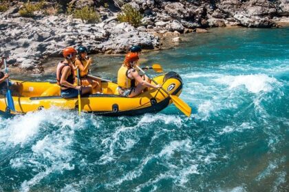 A glimpse of people enjoying rafting on the shimmering blue waters of Uttarakhand.