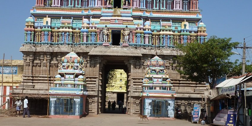 Front view of Uthirakosamangai Temple showing entrance and shops surrounding the complex