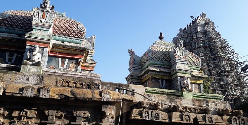 Front view of the top section of Sowmya Narayana Perumal Temple featuring idol sculptures on towers