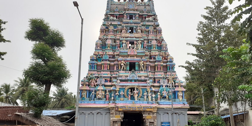 A view of the quaint Thirumanancheri Temple adorned with intricate carvings and hues.