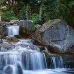 The amazing waterfall flowing through the rocks resembling Thirumoorthy Waterfalls.