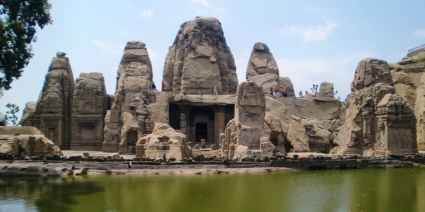 Ancient temple with intricately carved stone serving as monumental evidence for religious beliefs