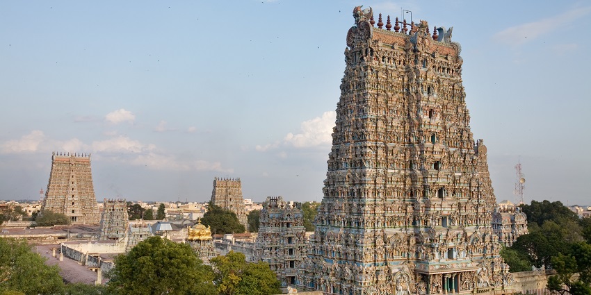 A distant aerial view of an extremely tall temple that has astonishing architecture