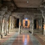 Thiruvaiyaru Temple halls with grand, carved pillars and ancient stone structures.