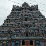 The Jambukeswarar Akilandeswari Temple shows a sign board and beautifully sculpted exterior