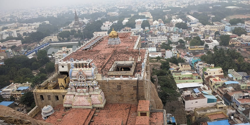 Aerial view of Tiruchirappalli Rock Fort, showcasing the temple structures surrounded by the town.