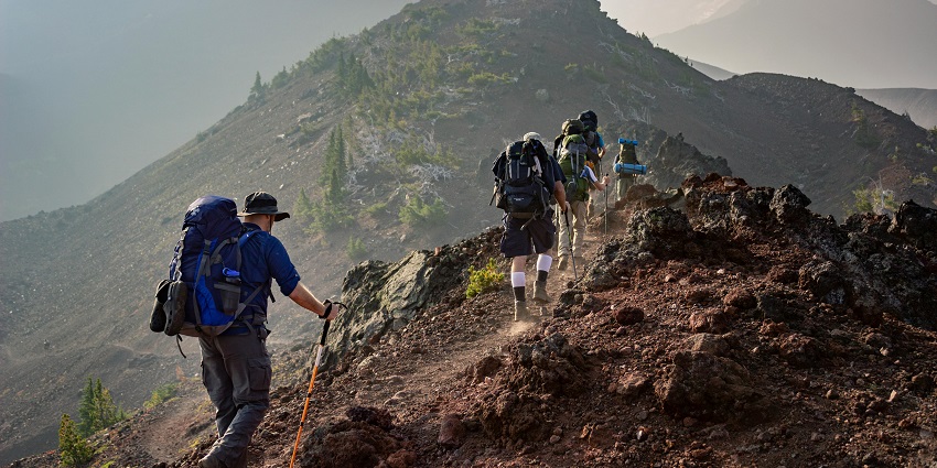 Image of tourists trekking amidst the thrilling and rugged terrains