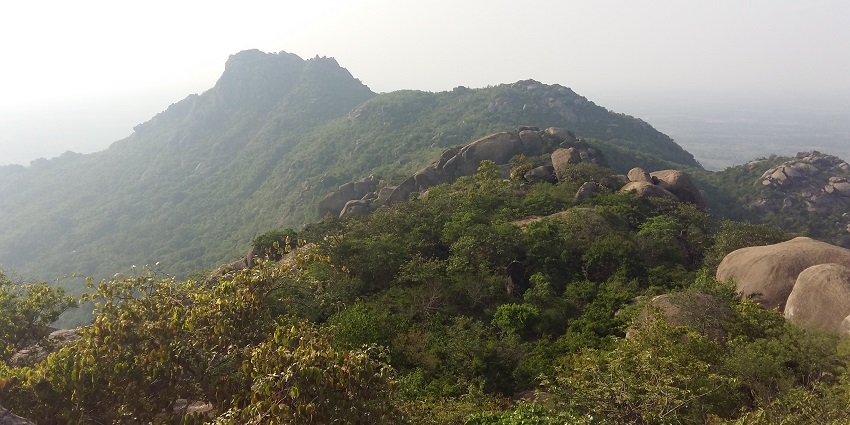 A view of the rocky and lush green Trikut Hills in Deoghar District of Jharkhand.