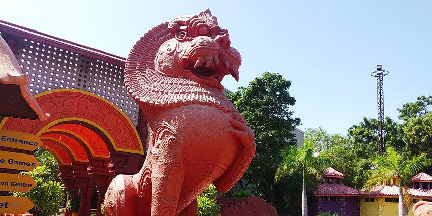 A large statue of a lion stands tall at VGP Universal Kingdom amusement park in Chennai.