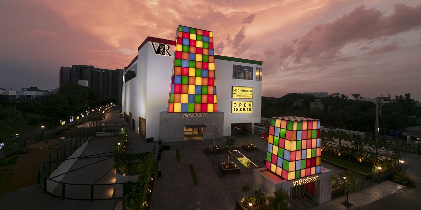 Upscale shopping destination with brands, restaurants, and recreational activities.