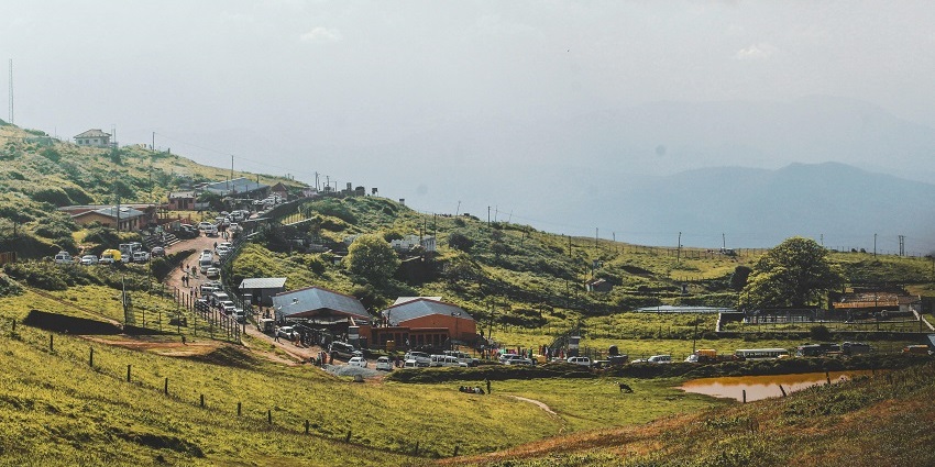 An image of Valparai that is surrounded by tea plantations and lush green hills.