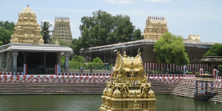 A submerged structure in a pond in front of the Varadaraja Perumal Temple in Tamil Nadu.