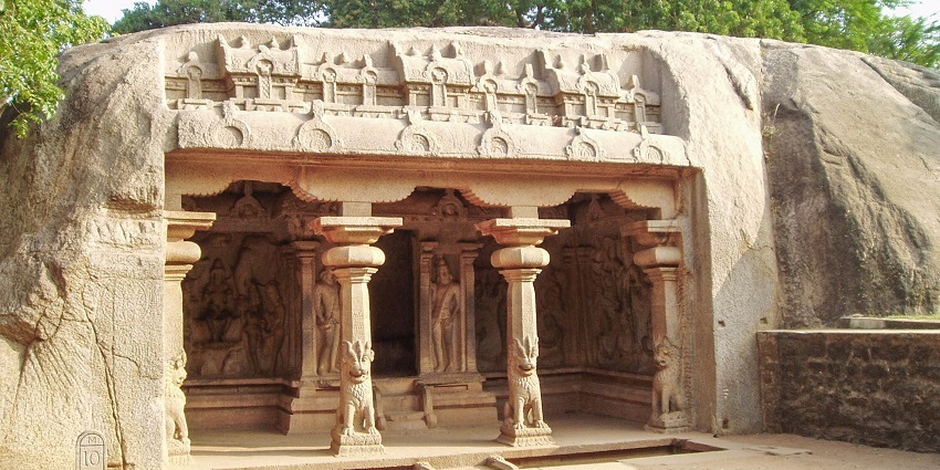 An outside view of the Varaha Cave Temple showcasing the intricately carved sculptures.