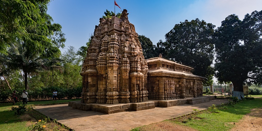 A stone-carved temple entrance with pillars at the temple.