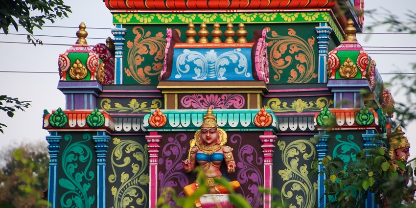 A frontal picture of a Varahi Amman temple in Chennai with blue walls and carvings