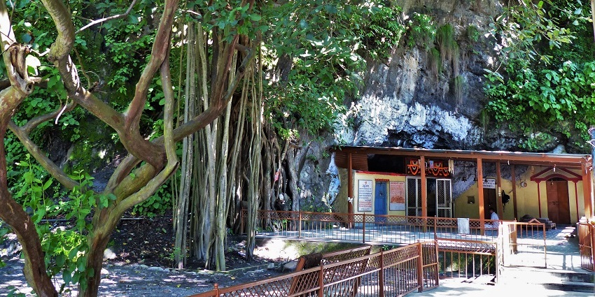 Ancient meditation cave by the Ganges, perfect for solitude seekers.