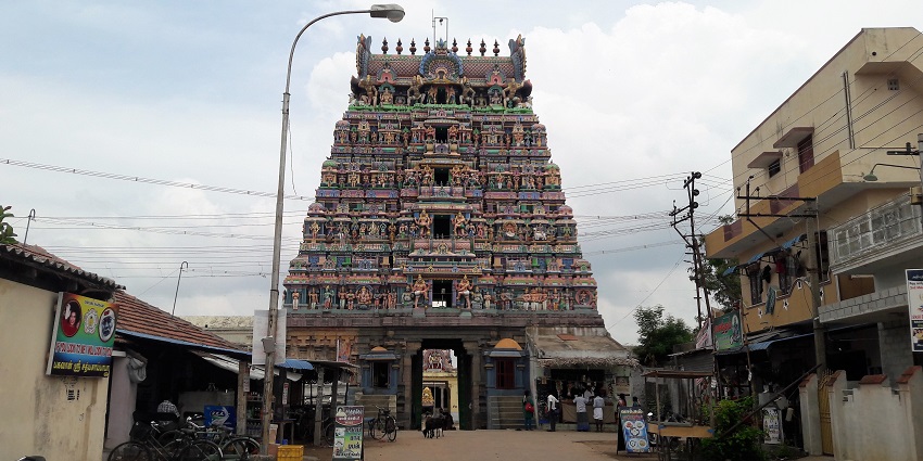 Vedaranyeswarar Temple with its grand architecturally detailed structure on a street