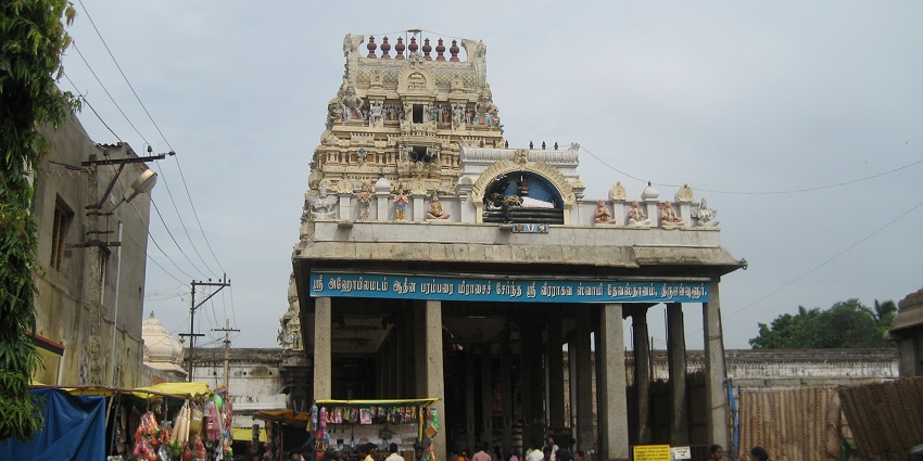 Veeraraghava Perumal Temple entrance with traditional Dravidian architecture and devotees