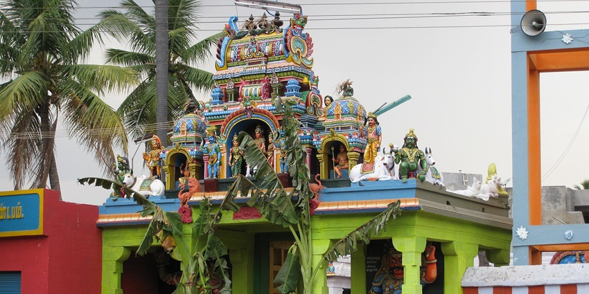 Outside of Muthiah Kovil, with its Dravidian architectural style near Ayyanar Temple.