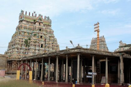 Virudhachalam Temple with intricate gopuram, pillared hall, and vibrant architecture.