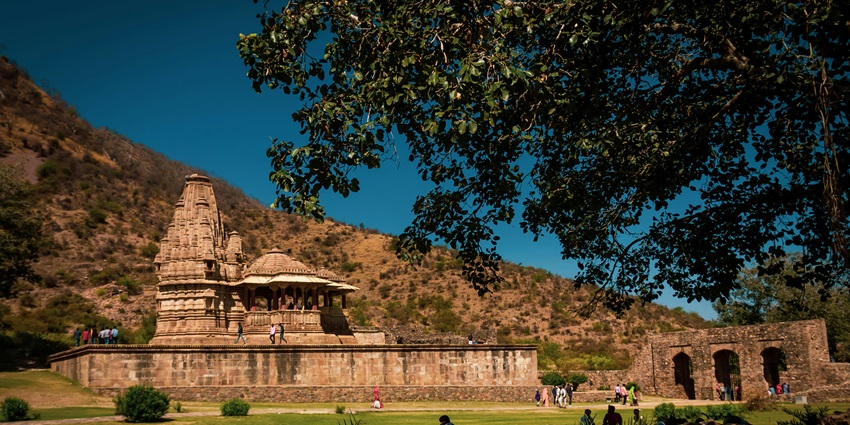 Wide angle view of the temple architecture surrounded by green landscapes.