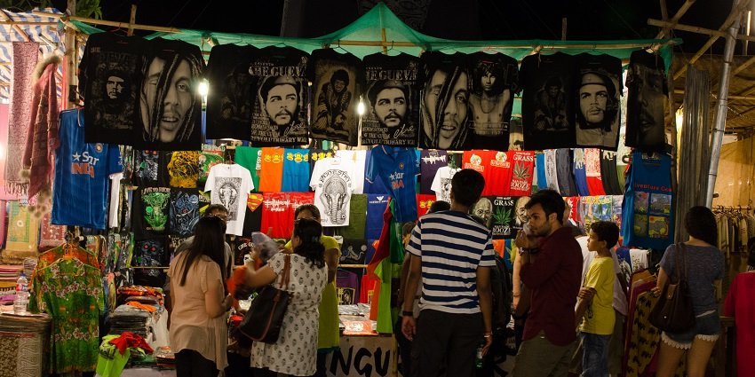 Exploring the vibrant night market in Pondicherry, where locals and tourists shop and enjoy street food.