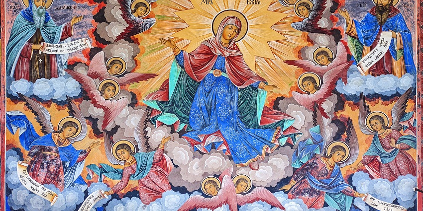 Rila Monastery Museum with vibrant, colourful paintings on the wall and a light bulb.