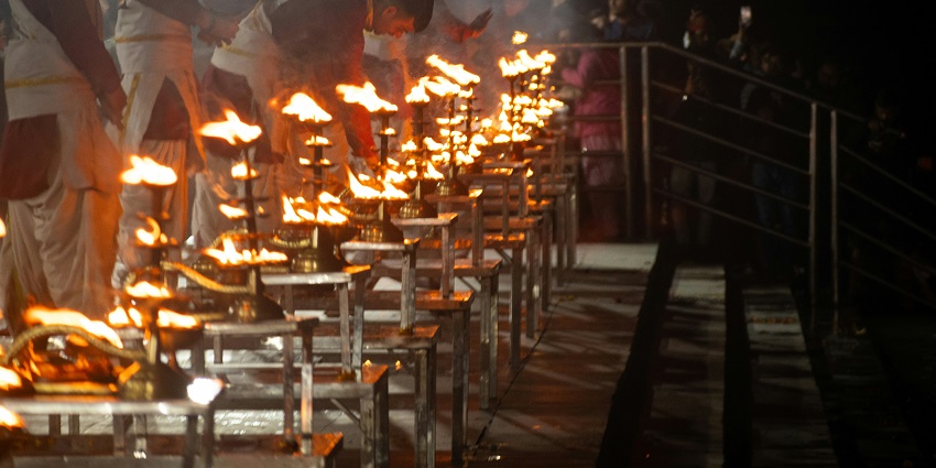 A glimpse of an aarti being performed by saints during the night at the Triveni Ghat.