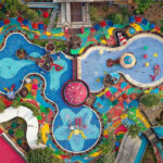 An aerial view of a famous leisure attraction in Uttarakhand with clourful rides.