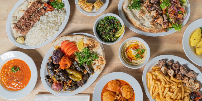 A picture of a table at a restaurant with north Indian delicacies placed all over it