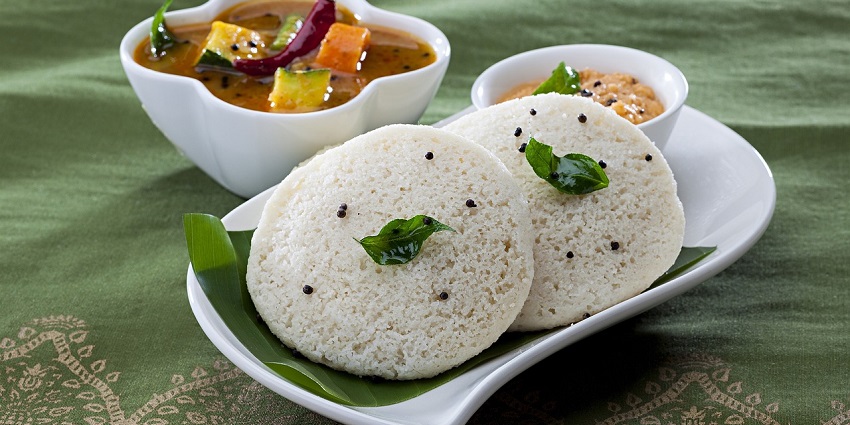 Image of idli served with sambhar curry, one of the famous local dish at an eatery nearby
