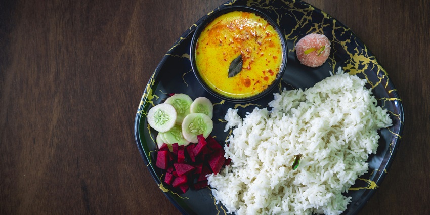Image representing traditional North Indian meal with local dishes served in Pilibhit.
