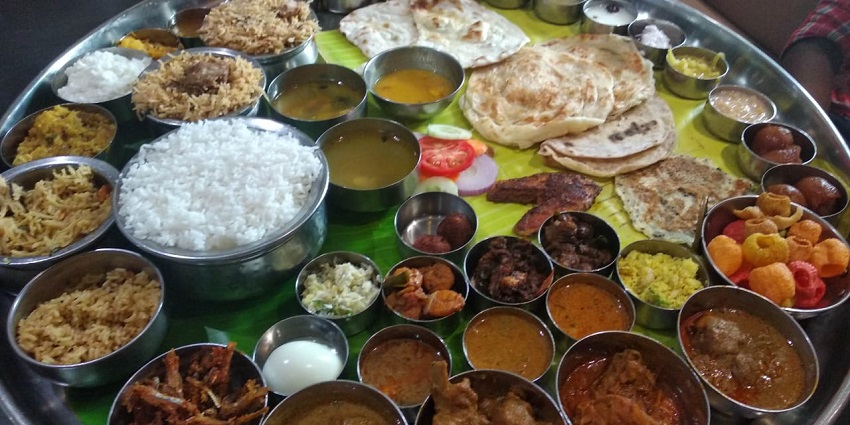 Baahubali thali with a variety of South Indian dishes with rice, curry and other things