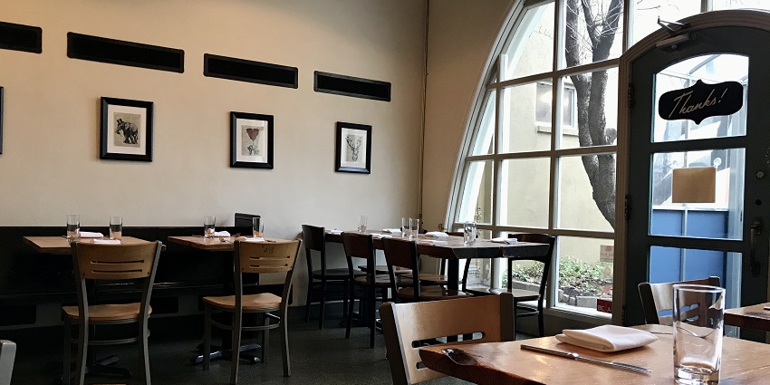 Cosy restaurant seating with stylish decor near Bhalu Gaad Waterfalls