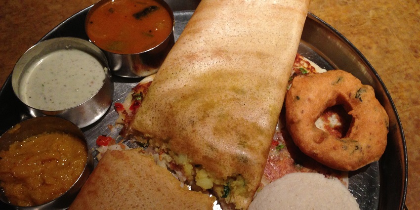 An image of a traditional South Indian food thaali , showcasing the region’s cuisine.