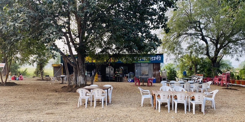 View of a dhaba serving North Indian cuisine near Naugarh Fort with an open space for sitting and dining
