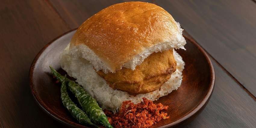 A picture of a Vada pav, a savoury snack to enjoy after a day of Harihar Fort trekking.