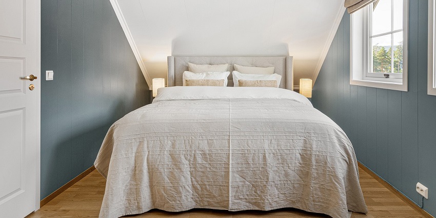 Modern bedroom interior design featuring a sleek bed and contemporary decor.