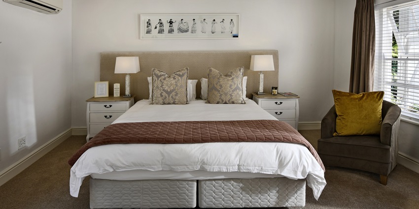 Comfortable and spacious bedroom with a king-size bed, perfect for a relaxing stay.