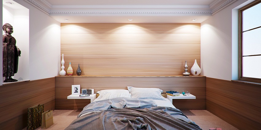 Cosy apartment bedroom with a comfortable bed, warm decor, and inviting ambiance.