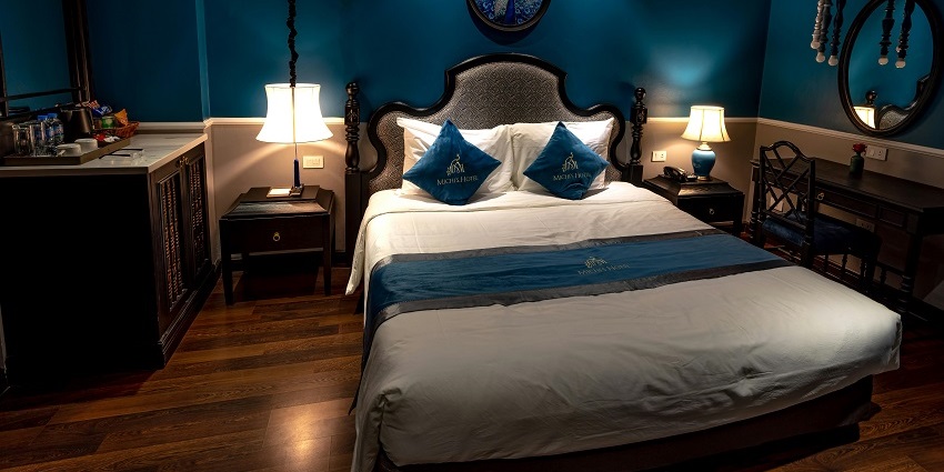 Cosy hotel room featuring classic interior design, offering a comfortable and inviting atmosphere for guests.