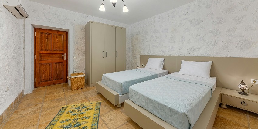 Comfortable hotel room with plush double beds, perfect for a peaceful and relaxing stay.
