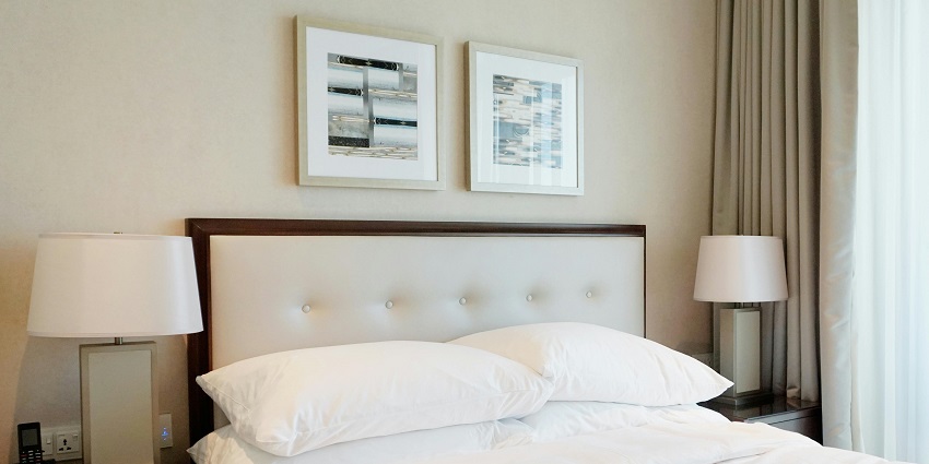 Inside view of a hotel room that has a comfortable bed and has been decorated nicely
